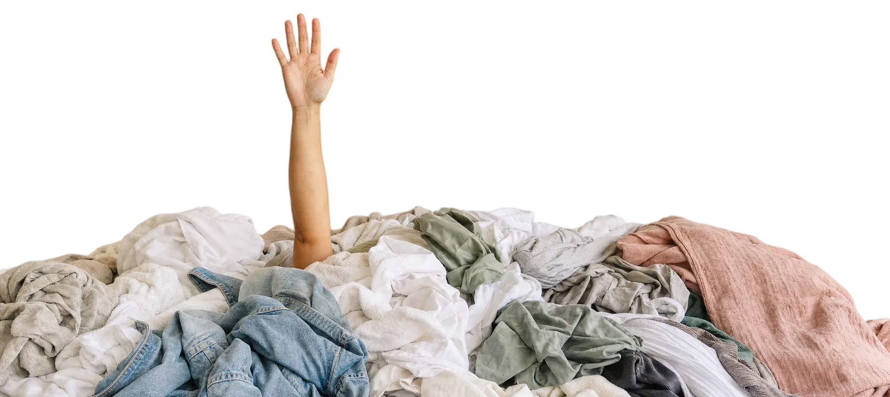 A hand reaching up out of a heap of laundry